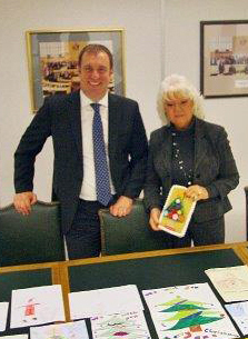 Councillor Maxi Martin & Turners Property director, Robert Davies,  Judging the Turners annual xmas card comeptiton