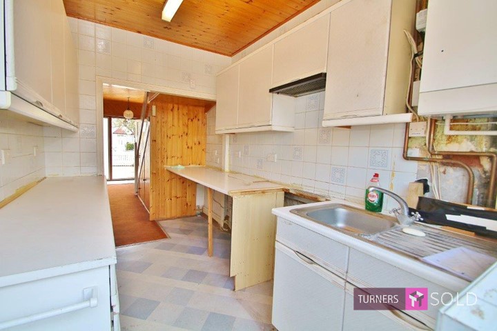 Picture of Kitchen needing redecoration in house for sale in Merton Park, Morden