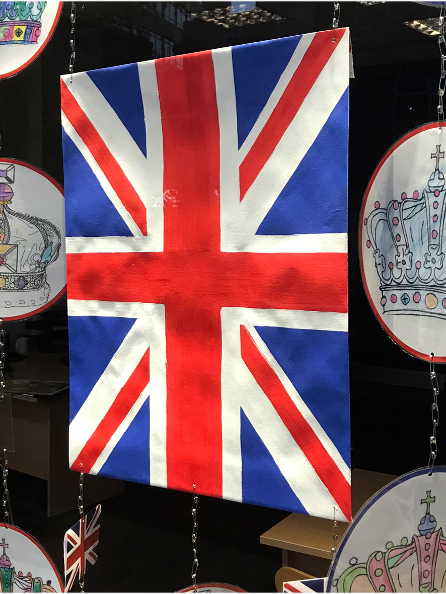 Platinum Jubilee window display showing hand-painted union jack flag in Turners estate agents, Morden